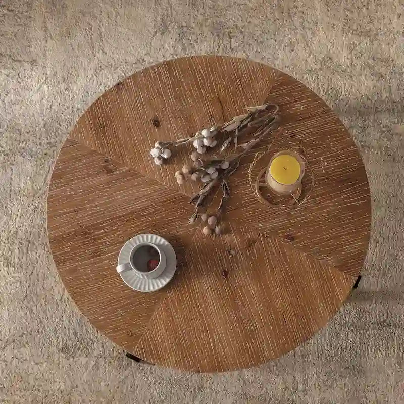Table basse ronde moderne rétro à empiècements avec pieds croisés